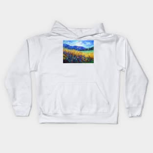 Blooming field near the mountains Kids Hoodie